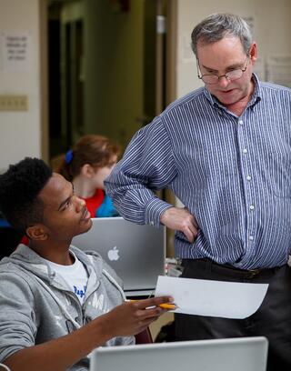Tom Scullin in classroom with Maurice Butler, '17