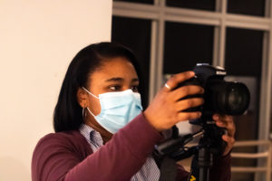 Image of Na'Chelle Morris '22 taking photos to document the 2021 Faculty Biennial