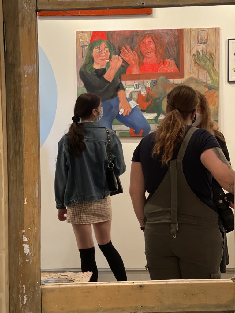 members of hte Class of 2021 tour the senior exhibition 
