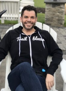 Todd Snovel, relaxed photo in Adirondack chair
