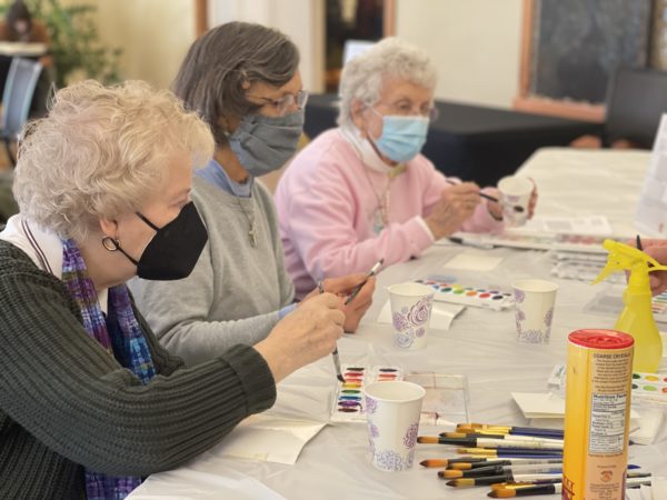Three Garden Spot Village residents experiment with watercolors.