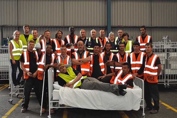 Crew from Tait relaxing on bed used in London Olympics and delivered afterward for hospital use.