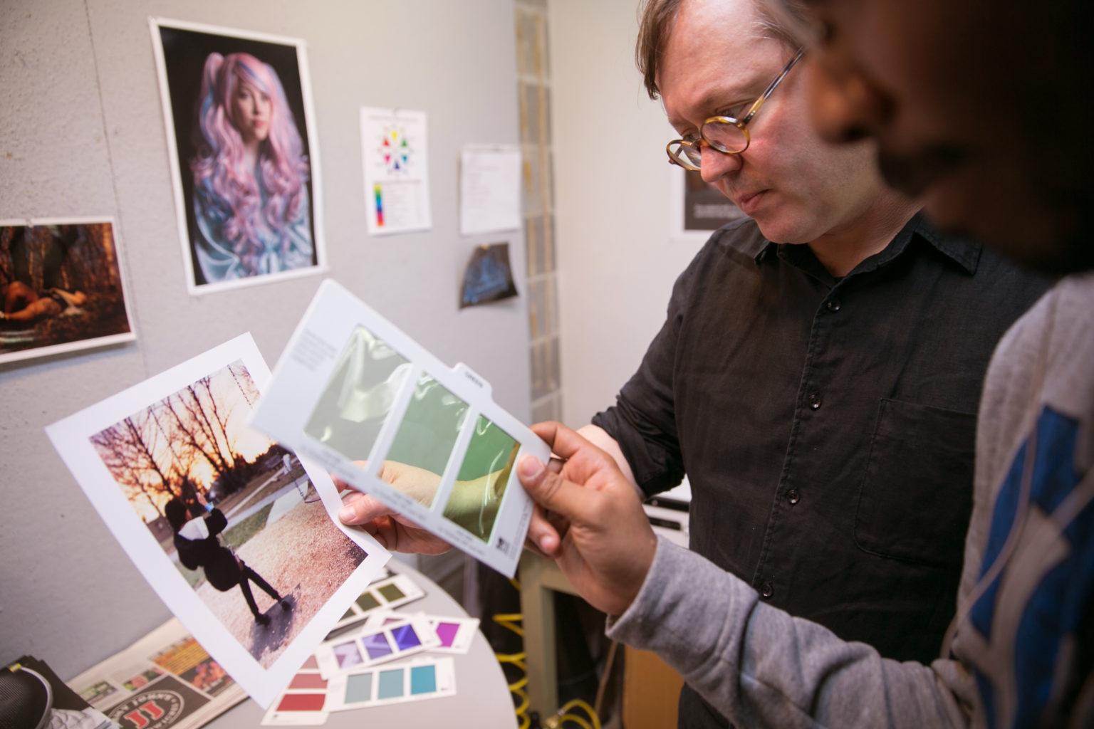 Eric Weeks discusses mockups with a student